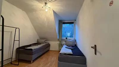 Ein Bett oder Betten in einem Zimmer der Unterkunft Monteurwohnung 3 Ferienwohnung Business Appartement Velbert 6 Personen
