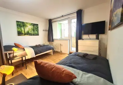 Ein Bett oder Betten in einem Zimmer der Unterkunft Moderne Wohnung mit Balkon und top Anbindung