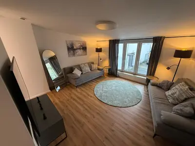 Ein Sitzbereich in der Unterkunft NEU - APARTMENT FOR 6 IN HAGEN- DIRECT PARKING! A45 - A1 - A46 Richtung Dortmund Netflix - WIFI, Fully-Automatic-COFFEMASHINE, KITCHEN, NETFLIX, DISNEY