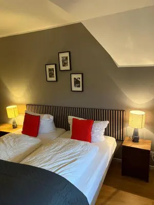 Ein Bett oder Betten in einem Zimmer der Unterkunft Rehmanns Hof