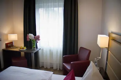 Ein Bett oder Betten in einem Zimmer der Unterkunft Hotel Restaurant Passmann