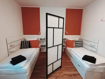 Ein Bett oder Betten in einem Zimmer der Unterkunft Case 3 BR 6 P Parking & Privat-Entry