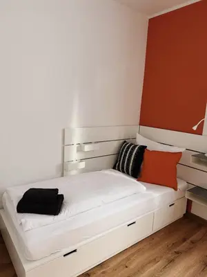 Ein Bett oder Betten in einem Zimmer der Unterkunft Case 3 BR 6 P Parking & Privat-Entry