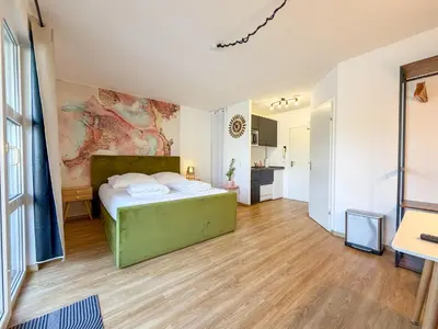 Ein Bett oder Betten in einem Zimmer der Unterkunft Apartment with balcony, good parking for long stay