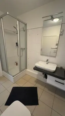 Ein Badezimmer in der Unterkunft Zum Postwagen Apartments