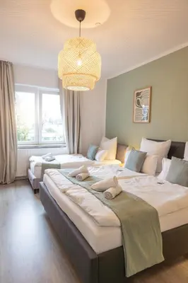 Ein Bett oder Betten in einem Zimmer der Unterkunft Stilvolles Apartment Nähe City & Events in Bochum