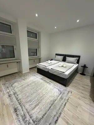 Ein Bett oder Betten in einem Zimmer der Unterkunft Zentrales Apartment mit Terrasse neu renoviert