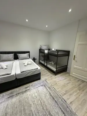 Ein Bett oder Betten in einem Zimmer der Unterkunft Zentrales Apartment mit Terrasse neu renoviert