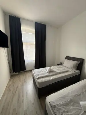 Ein Bett oder Betten in einem Zimmer der Unterkunft Ferienwohnung Essen Frohnhausen 2