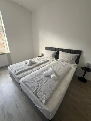 Ein Bett oder Betten in einem Zimmer der Unterkunft Ferienwohnung Essen Frohnhausen 2