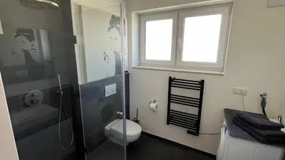 Ein Badezimmer in der Unterkunft Neue und modische Wohnung im Duisburger Süden