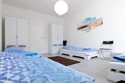 Ein Bett oder Betten in einem Zimmer der Unterkunft apartmondo Ferienwohnungen Solingen