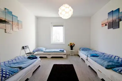 Ein Bett oder Betten in einem Zimmer der Unterkunft apartmondo Ferienwohnungen Solingen