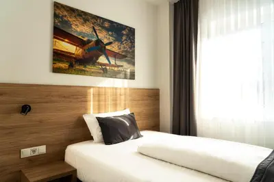 Ein Bett oder Betten in einem Zimmer der Unterkunft LivInn by Trotmannia