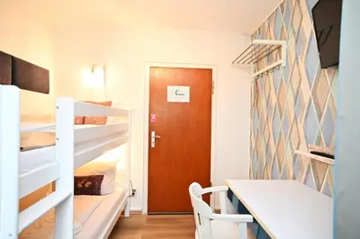 Ein Bett oder Betten in einem Zimmer der Unterkunft Self check in City Hostel Nordstern