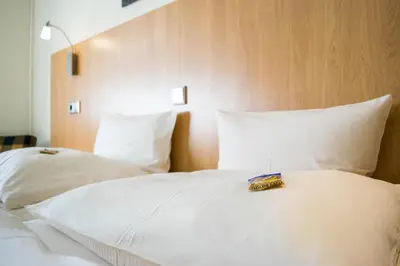 Ein Bett oder Betten in einem Zimmer der Unterkunft Hotel Postkutsche