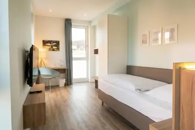 Ein Bett oder Betten in einem Zimmer der Unterkunft Steverbett Hotel