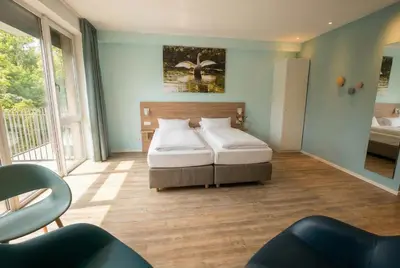 Ein Bett oder Betten in einem Zimmer der Unterkunft Steverbett Hotel