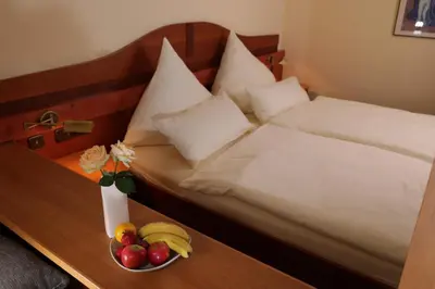 Ein Bett oder Betten in einem Zimmer der Unterkunft Hotel Restaurant Fischer