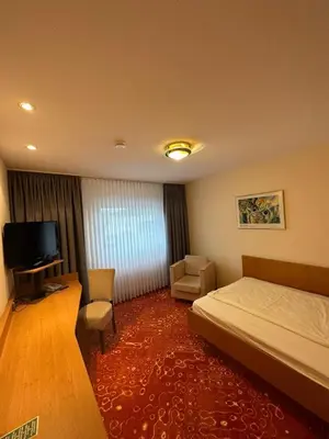 Ein Bett oder Betten in einem Zimmer der Unterkunft Hotel Restaurant Fischer