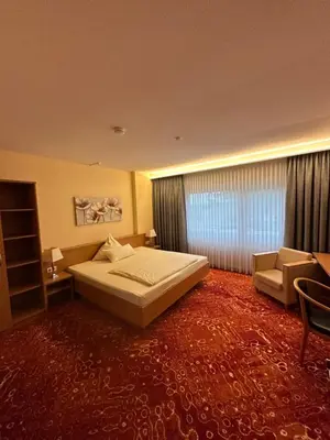Ein Bett oder Betten in einem Zimmer der Unterkunft Hotel Restaurant Fischer