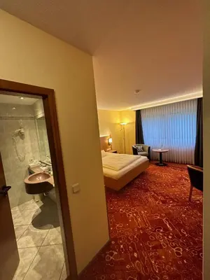Ein Bett oder Betten in einem Zimmer der Unterkunft Hotel Restaurant Fischer