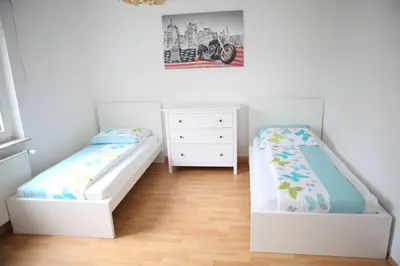 Ein Bett oder Betten in einem Zimmer der Unterkunft White House Bochum II