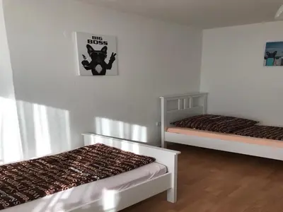 Ein Bett oder Betten in einem Zimmer der Unterkunft White House Bochum II