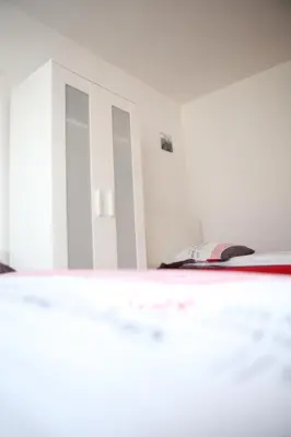 Ein Bett oder Betten in einem Zimmer der Unterkunft White House Bochum II