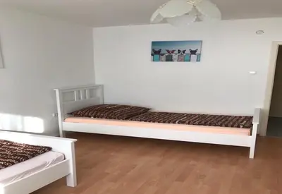 Ein Bett oder Betten in einem Zimmer der Unterkunft White House Bochum II