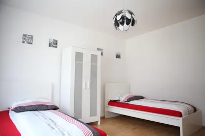 Ein Bett oder Betten in einem Zimmer der Unterkunft White House Bochum II