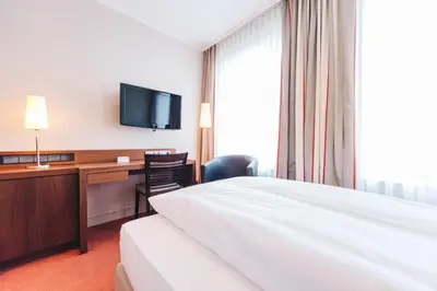 Ein Bett oder Betten in einem Zimmer der Unterkunft HOTEL KOCKS am Mühlenberg
