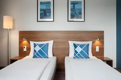 Ein Bett oder Betten in einem Zimmer der Unterkunft Four Points Flex by Sheraton Essen