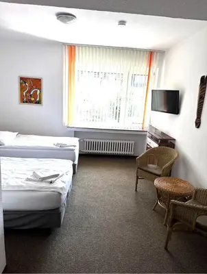 Ein Bett oder Betten in einem Zimmer der Unterkunft Hotel Lintforter Hof
