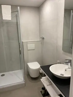 Ein Badezimmer in der Unterkunft Das kleine Landhotel