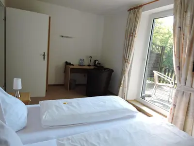 Ein Bett oder Betten in einem Zimmer der Unterkunft Hotel Bergische Schweiz