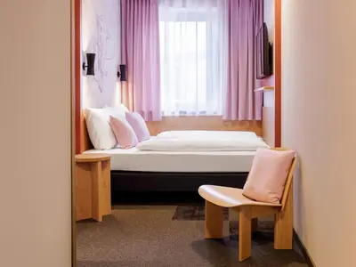 Ein Bett oder Betten in einem Zimmer der Unterkunft McDreams Hotel Wuppertal City