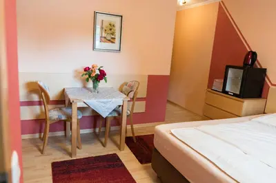 Ein Bett oder Betten in einem Zimmer der Unterkunft City Hotel Hilden