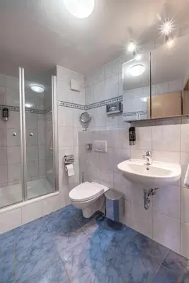Ein Badezimmer in der Unterkunft City Hotel Hilden