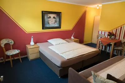 Ein Bett oder Betten in einem Zimmer der Unterkunft City Hotel Hilden