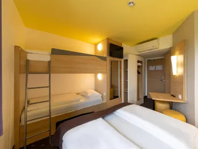 Ein Bett oder Betten in einem Zimmer der Unterkunft B&B Hotel Oberhausen am Centro