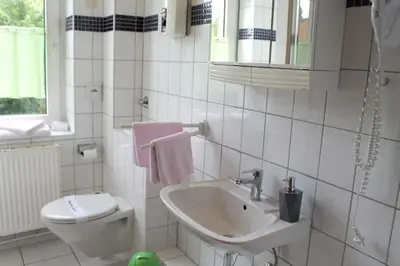 Ein Badezimmer in der Unterkunft TM Apart Hotel Essen