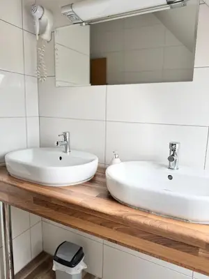 Ein Badezimmer in der Unterkunft TM Apart Hotel Essen