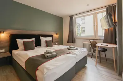 Ein Bett oder Betten in einem Zimmer der Unterkunft Hotel Enger Hof