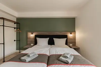 Ein Bett oder Betten in einem Zimmer der Unterkunft Hotel Enger Hof