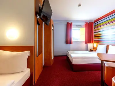 Ein Bett oder Betten in einem Zimmer der Unterkunft Hotel Rhynern Nord