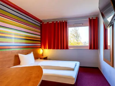 Ein Bett oder Betten in einem Zimmer der Unterkunft Hotel Rhynern Nord