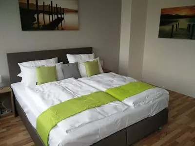 Ein Bett oder Betten in einem Zimmer der Unterkunft Hotel Art Inn Dinslaken