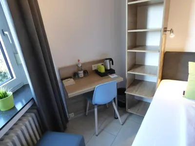 Ein Bett oder Betten in einem Zimmer der Unterkunft Hotel Art Inn Dinslaken