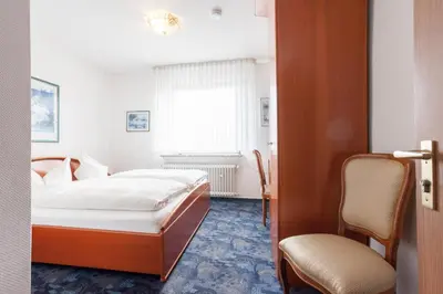 Ein Bett oder Betten in einem Zimmer der Unterkunft TM Hotel Dortmund Airport